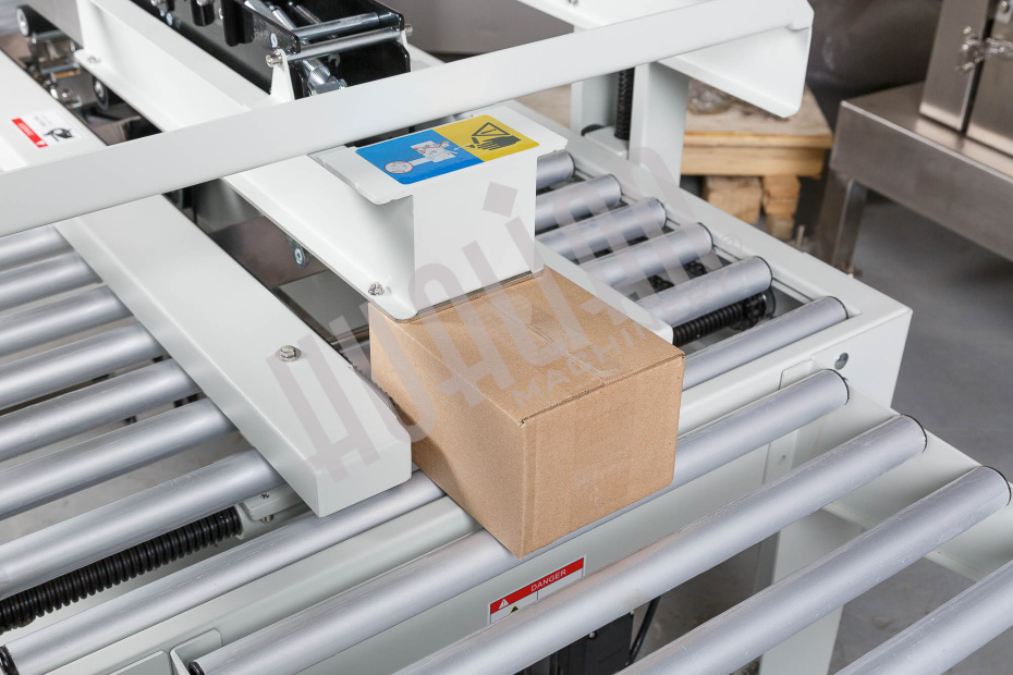 Полуавтоматический заклейщик коробов FXJ-2550X Hualian - Купить с доставкой по всей Беларуси