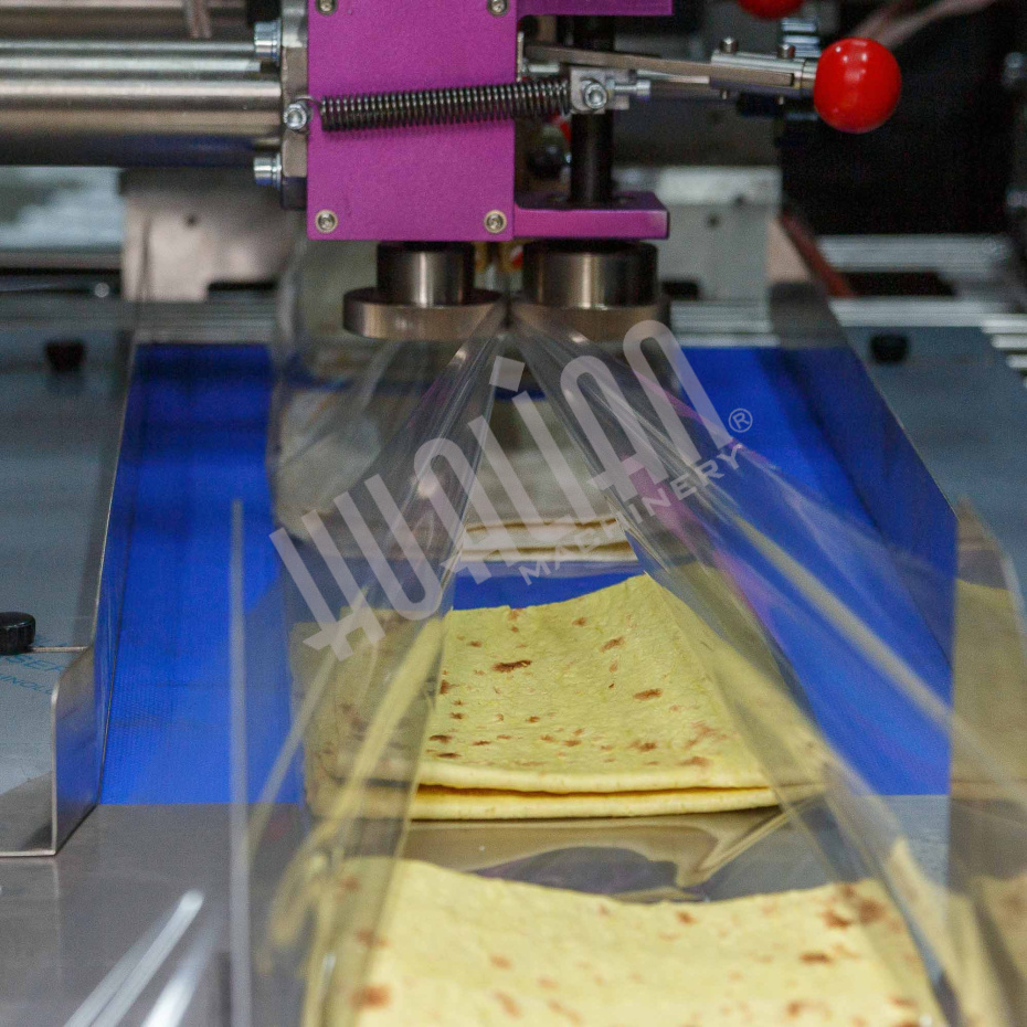 Горизонтальная упаковочная машина DXDZ-600XD (лент. 250 мм, рег.форм., S 400, L 180-500, H-120, трансп.попереч.запайки) Hualian - Купить с доставкой по всей Беларуси