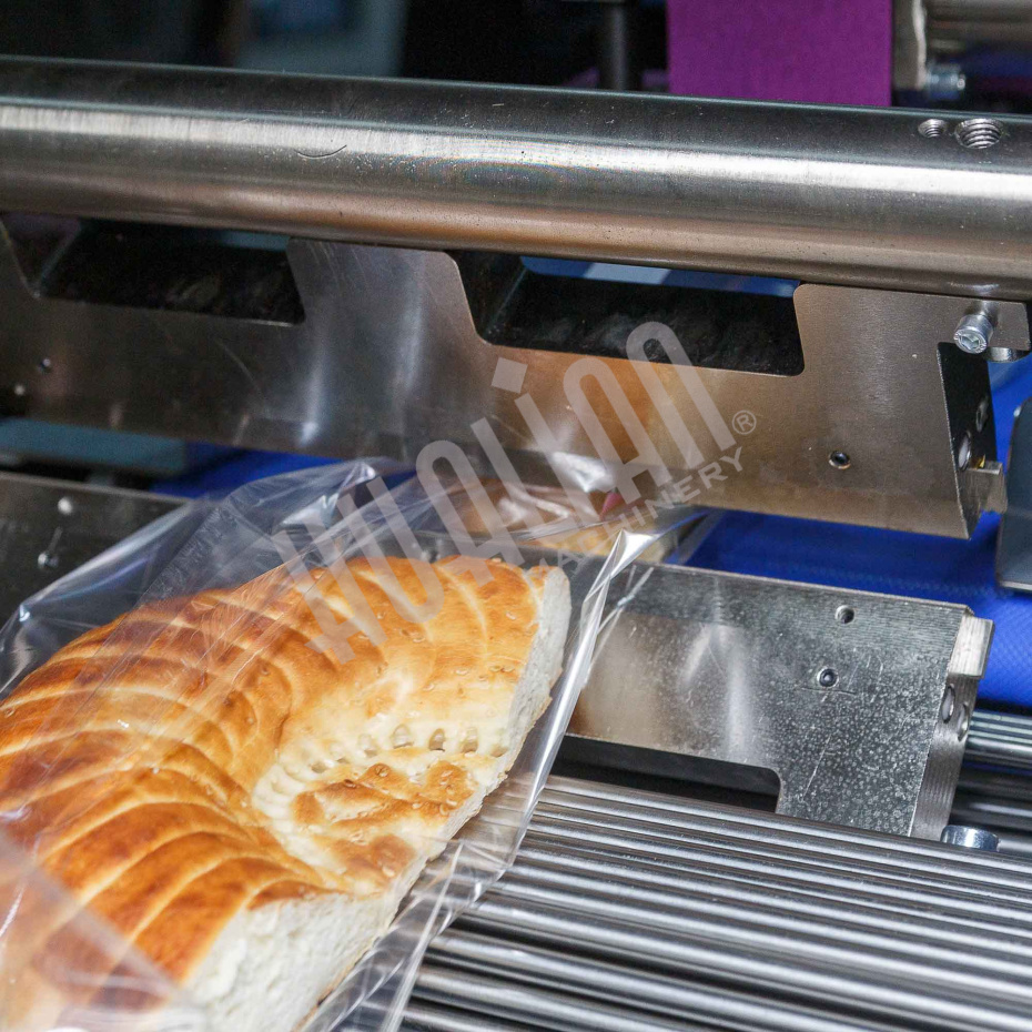 Горизонтальная упаковочная машина DXDZ-600XD (лент. 250 мм, рег.форм., S 400, L 180-500, H-120, трансп.попереч.запайки) Hualian - Купить с доставкой по всей Беларуси