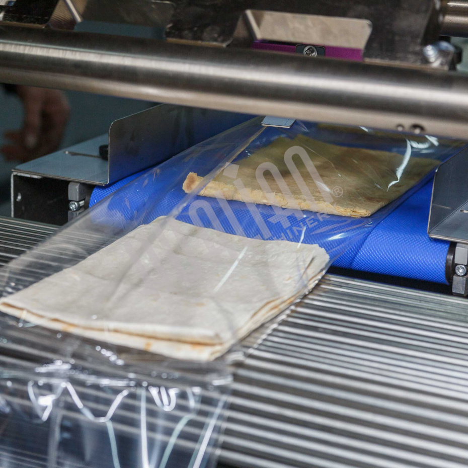 Горизонтальная упаковочная машина DXDZ-600XD (лент. 250 мм, рег.форм., S 400, L 180-500, H-120, трансп.попереч.запайки) Hualian - Купить с доставкой по всей Беларуси