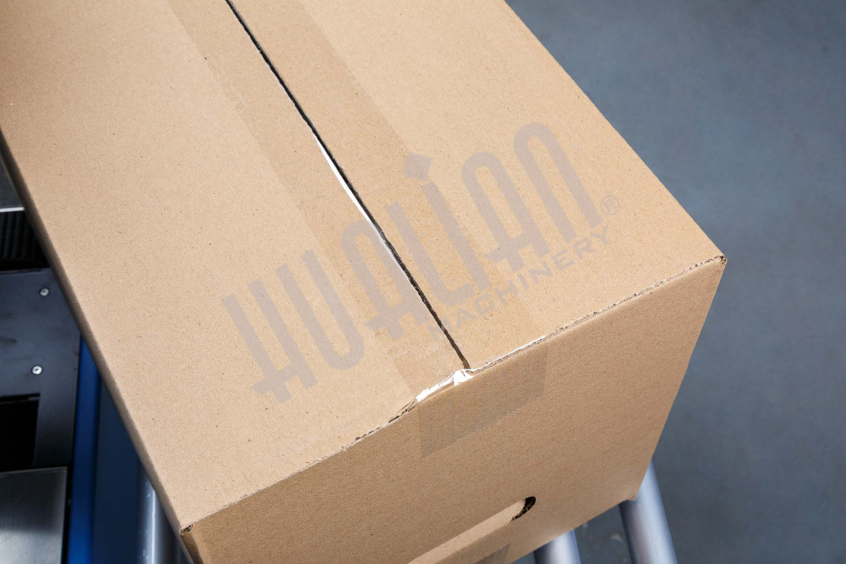 Полуавтоматический заклейщик коробов FXJ-6050С Hualian - Купить с доставкой по всей Беларуси