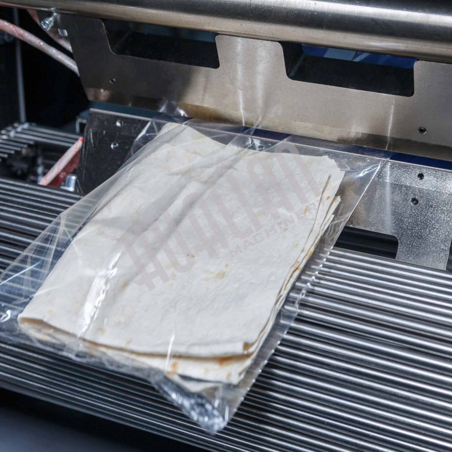 Горизонтальная упаковочная машина DXDZ-600XD (лент. 250 мм, рег.форм., S 400, L 180-500, H-120, трансп.попереч.запайки) Hualian - Купить с доставкой по всей Беларуси