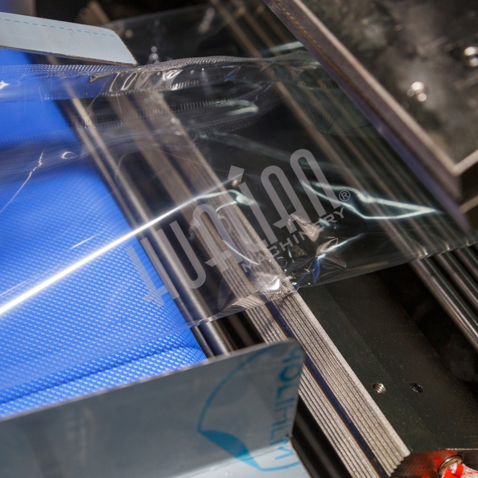 Горизонтальная упаковочная машина DXDZ-600XD (3 серв., H-110 мм, L не огр., W 145-285 мм, HL-1108, круг. отв., подбой, прок. пакета) Hualian - Купить с доставкой по всей Беларуси